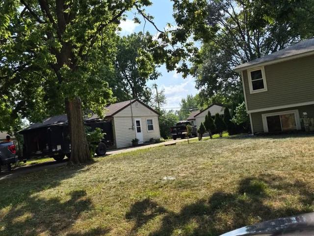 Crew clearing branches from a front yard